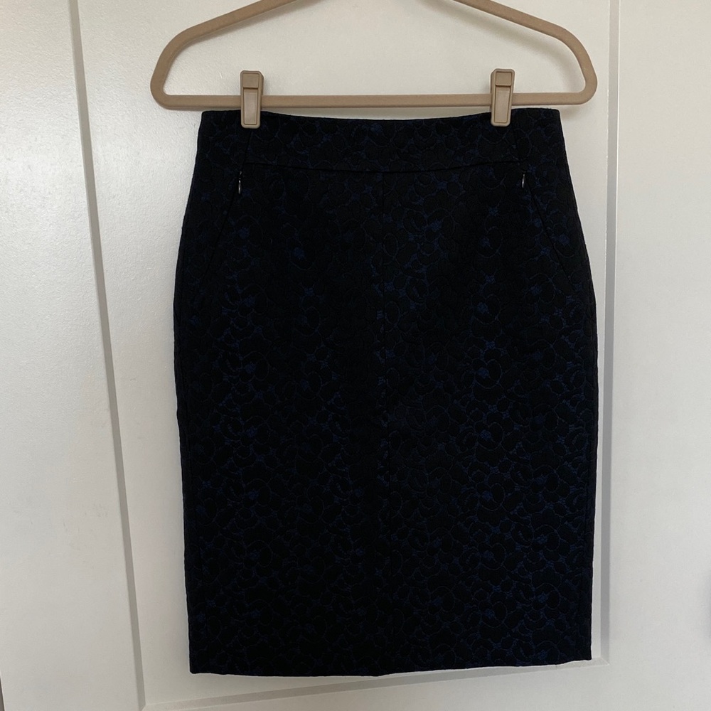 Classic black and blue pencil skirt with lace overlay.